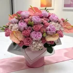 pink flower arrangement in box ready for NYC delivery
