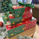 Festive WOWBouquet dessert box with Santa themed packaging and green ribbon