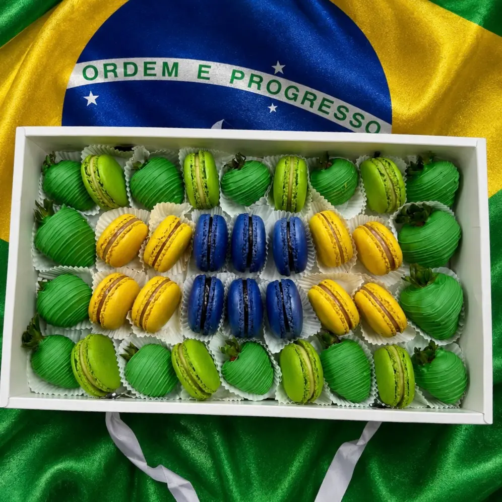 Brazil World Cup gift box with chocolate covered strawberries and macarons in red and white flag colors World Cup Brazil sweets box featuring chocolate dipped strawberries and macarons arranged in team colors