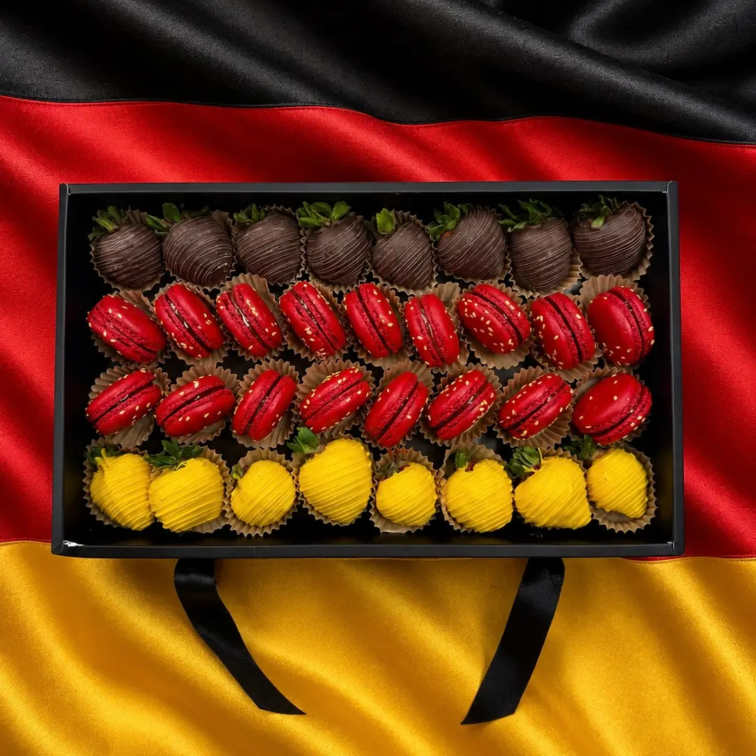 Germany flag inspired dessert gift box with gourmet chocolate strawberries and French macarons Germany soccer fan gift box with premium chocolate covered strawberries and red and white macarons