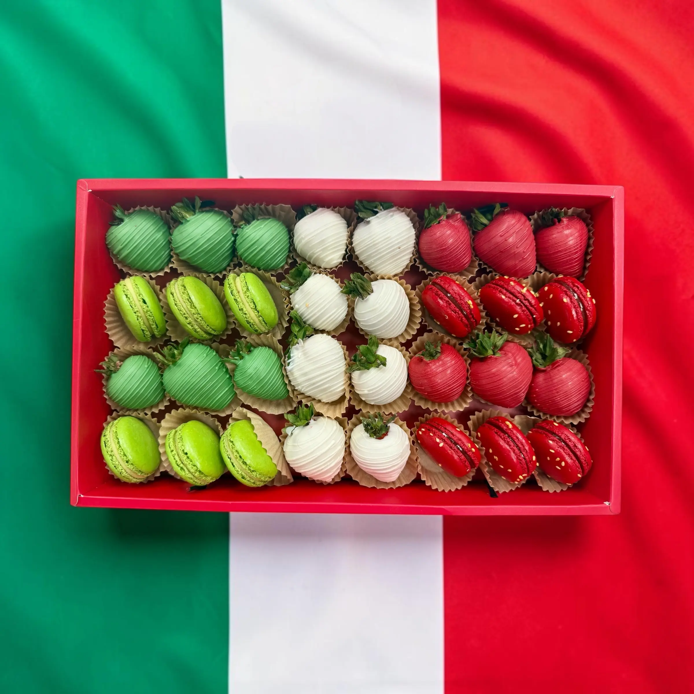 Italy World Cup gift box with chocolate covered strawberries and macarons in red and white flag colors World Cup Italy sweets box featuring chocolate dipped strawberries and macarons arranged in team colors