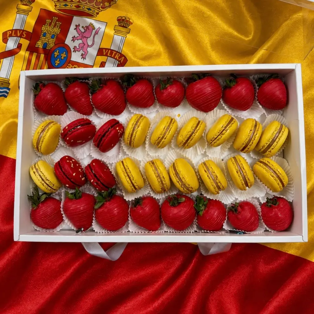 Spain flag inspired dessert gift box with gourmet chocolate strawberries and French macarons Spain soccer fan gift box with premium chocolate covered strawberries and red and white macarons