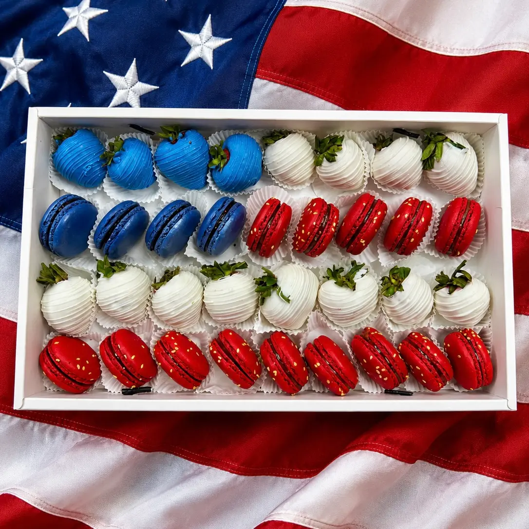 USA World Cup gift box with chocolate covered strawberries and macarons in red and white flag colors World Cup USA sweets box featuring chocolate dipped strawberries and macarons arranged in team colors