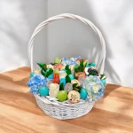 A luxurious baby gift basket including chocolate strawberries, macarons, and fresh blooms