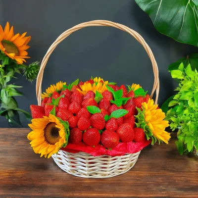 Cheerful fruit gift basket with sunflowers and strawberries, perfect for adding a touch of joy to any celebration