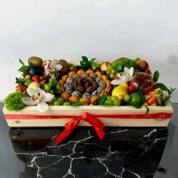 Beautifully arranged Circle Box with fresh fruits, chocolate-covered strawberries, and colorful macaroons
