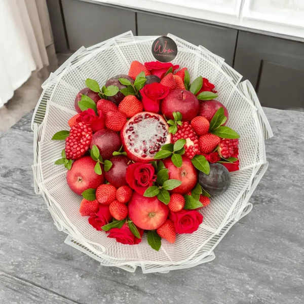 Unique fruit and floral arrangement with juicy plums and strawberries