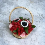 Elegant fruit gift basket with strawberries, blueberries, and coconut, perfect for birthday surprises