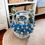 Premium Baby Gift Basket arranged with baby essentials and a touch of indulgence with chocolate covered strawberries, ideal for a new mom.