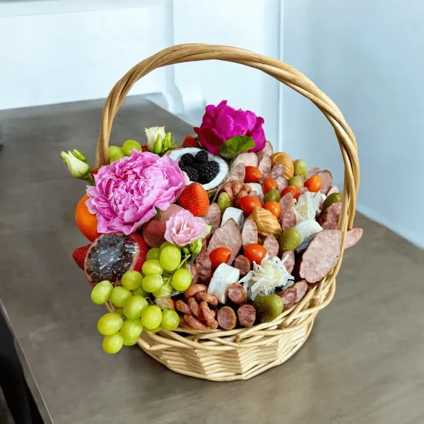 Beautifully arranged fruit and meat basket with artisanal selection