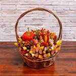 Meat and cheese basket with olives, peppers, and pickles