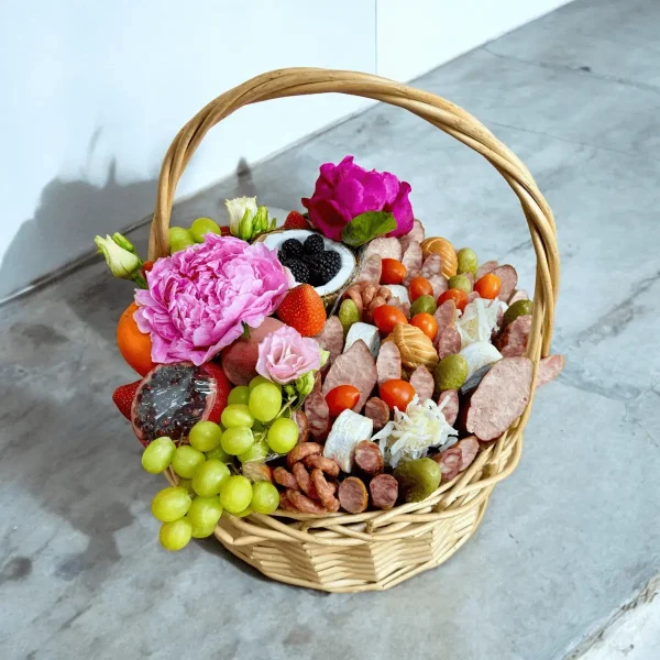 Mixed gift basket with fresh fruits and savory meats and cheeses