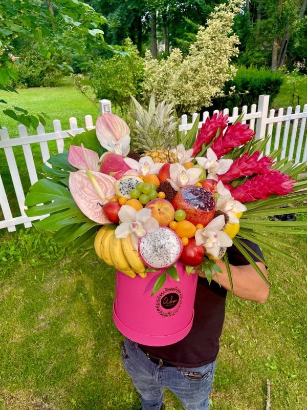 Tropical arrangement with exotic fruits and flowers
