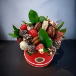 Elegant gift box with chocolate-dipped fruits and macarons