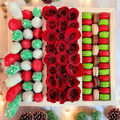 Treat yourself or someone special with our Sweets Box, filled with chocolate-covered strawberries, bananas, macarons, and stunning red roses.