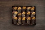 Exquisite chocolate-dipped orange slices in a gift box, offering a unique and irresistible twist on the classic chocolate orange flavor.