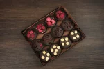 Gourmet French Chocolate Mendiants gift box, containing 12 handcrafted chocolates with berries and nuts, perfect for sophisticated palates.