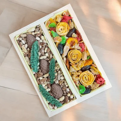 Creative Healthy Box featuring chocolate-made pines and a variety of nuts