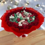 A festive combination of 2 dozen roses and chocolate-dipped pineapples, strawberries, cherries, and bananas, our Holiday Gift Bouquet is perfect for the holidays.