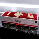 Roses Box with an extraordinary arrangement of 100 roses saying "I love you"