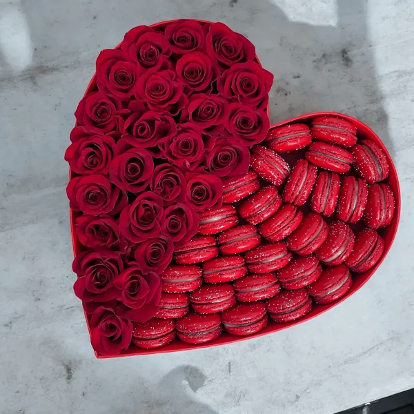 Luxurious box of red roses and a variety of gourmet macarons