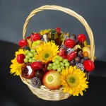 A vibrant Rosh Hashanah gift basket brimming with seasonal fruits, including apples, dates, figs, and pears, celebrating the arrival of a new year