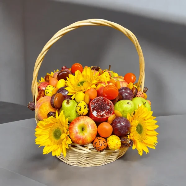Cozy Fall-themed basket featuring fresh seasonal fruits, dried fruits, and pumpkin macarons with chocolate-covered strawberries