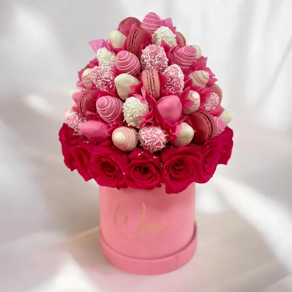 Pink Charm fruit and floral arrangement with chocolate strawberries and macarons