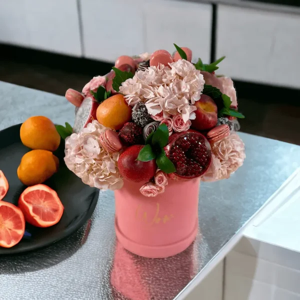 Tasteful Fruit Fiesta with fresh fruits and macarons complemented by blush pink hydrangeas