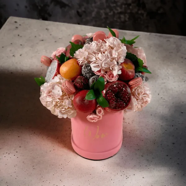 Blush Pink Fruit Fiesta offering a mix of tropical fruits and macarons with flowers