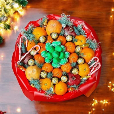 This Christmas Fruit Wreath offers a delightful combination of fresh fruits and chocolates, presented in a custom 16-inch wooden box.