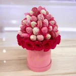 Thoughtful Pink Charm arrangement with pink roses and raspberry-flavored macarons