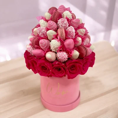 Pink Charm gift arrangement with delicate French macarons and chocolate strawberries