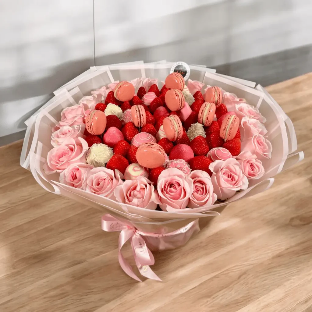 Pink Romance & Macarons bouquet combining strawberries, macarons, and roses