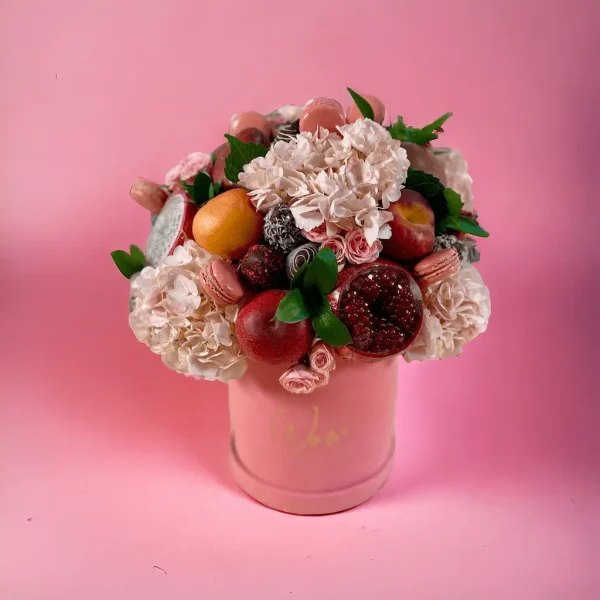 Fruit Fiesta combining mangoes, pears, and pink blooms in an exquisite arrangement