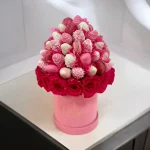 Pink Charm arrangement featuring rose lychee macarons and chocolate-covered strawberries