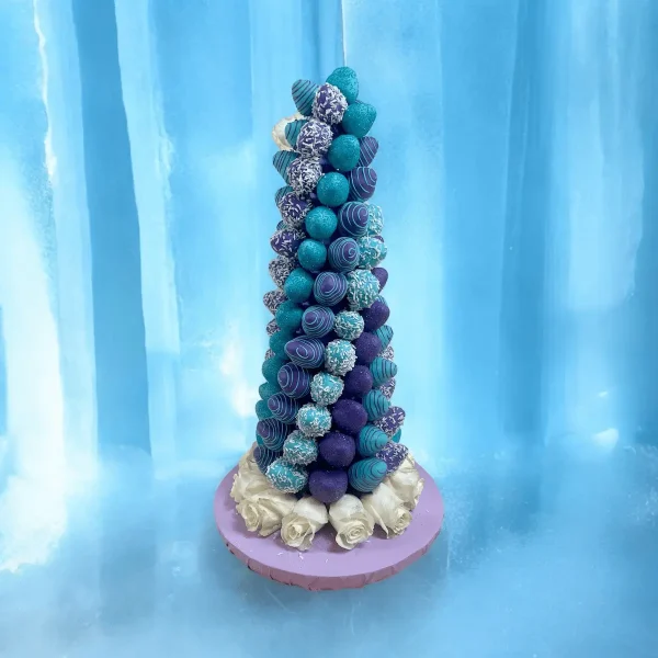 The Frozen-inspired Chocolate Strawberry Tower offers a striking presentation in two sizes, perfect for festive events.