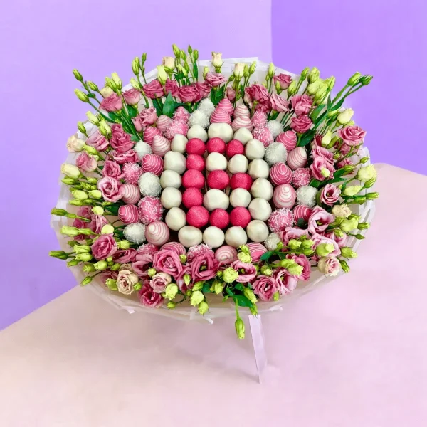 Letter-shaped floral arrangement with chocolate strawberries and flowers