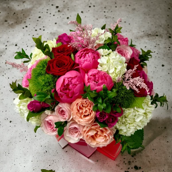 A detailed image of the SOHO Flowers bouquet, emphasizing its composition of red, pink, and white flowers, perfect for enhancing any event or space.