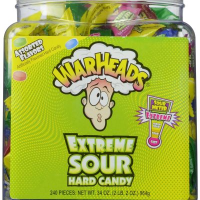 Close-up of Warheads candies, showcasing their round shape coated in sour sugar crystals.