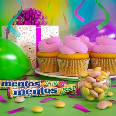 Close-up of Mentos candies, showcasing their round, smooth shape in various flavors and colors.