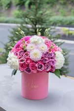 Bouquet set against a New York City skyline backdrop.