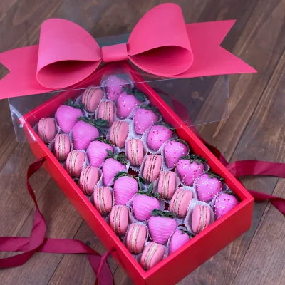 Pink chocolate-dipped strawberries in a luxury gift box.