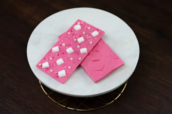 White chocolate bar with marshmallows on a dark background