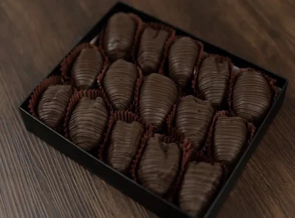 Artisanal chocolate dates arranged in a premium box.
