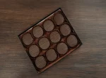 Luxurious chocolate covered Oreo cookies arranged beautifully.