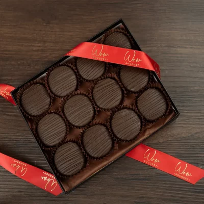 Box of 12 gourmet Oreos covered in dark chocolate.