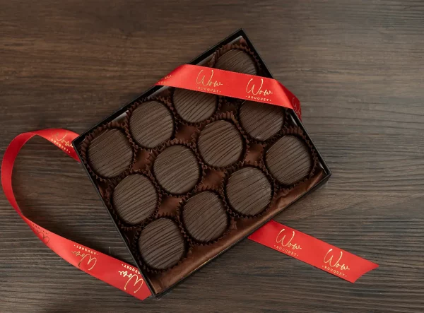 Box of 12 gourmet Oreos covered in dark chocolate.