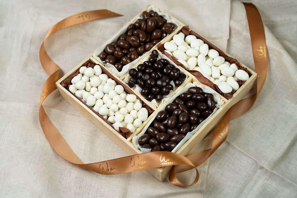 Elegant 10x10 Sweet and Nutty Gift Box filled with dark chocolate almonds, milk chocolate cashews, chocolate blueberries, and yogurt-covered nuts