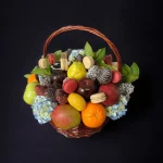 Picture of a Supreme Fruit & Floral basket, richly packed with a variety of fruits and enhanced with floral and confectionery touches for a delightful presentation.